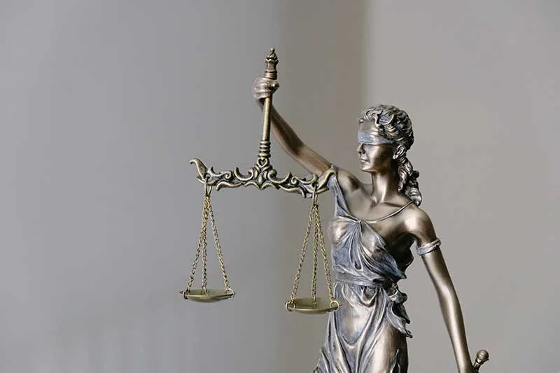 Justice scales incorporating tourism law